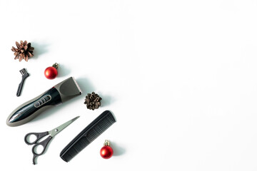 Christmas hairdresser composition with combs, brush, scissors, tools and accessories with new year decorations on white background. Stylish concept. Flat lay, top view with copy space