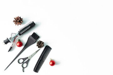 Christmas hairdresser composition with combs, brush, scissors, tools and accessories with new year decorations on white background. Stylish concept. Flat lay, top view with copy space