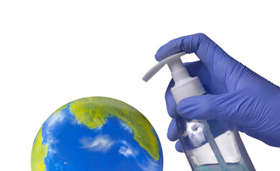 Planet earth globe receiving an hygienic antibacterial gel from surgical doctor hand.( The planet earth globe is a physical hand made model and digital edited by the photographer )