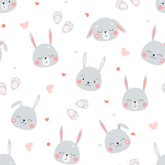 Seamless pattern with cute funny bunnies. The head of rabbits with hearts on a white background. Children's ornament for textiles, fabrics. Vector graphics.
