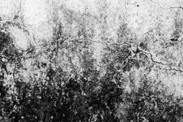 Black and white image of concrete cracks with heavy grunge texture