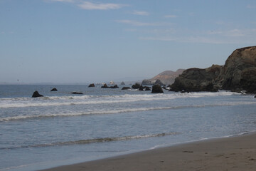 Fototapeta na wymiar Coastline view with beach and rocks