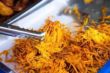 Burmese and Lanna appetizer, cooked using battered papaya strips, known as 