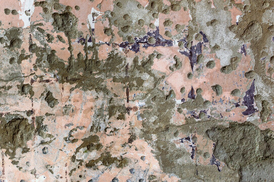 Naturalne tło, tekstura obdarte z glazury ulicznej ściany. 