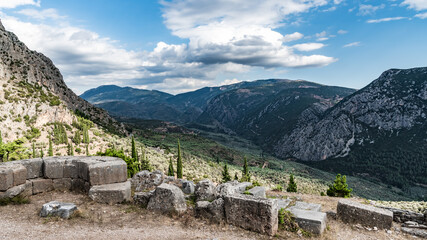 Fototapeta na wymiar Ancient ruins on the mountain slopes in Delphi