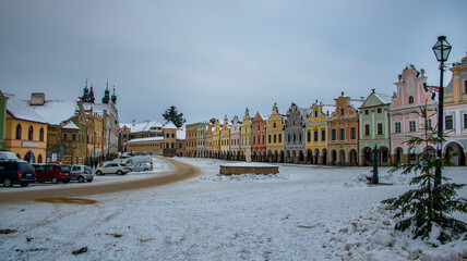 Fototapeta na wymiar Square in old Telc town in winter dark cold morning