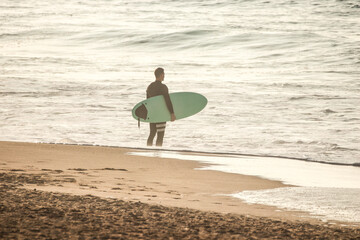 Fototapeta na wymiar Surfer looking the sea in a beach.