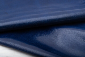 blue folded natural glossy cow leather - material for handbags and shoes	
