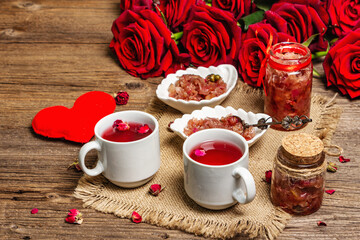 Tea time with rose petals jam and hot beverage
