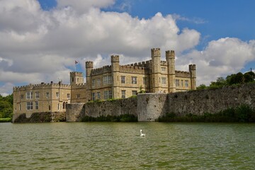 The scenic view of Leeds castle. Leeds Castle is a castle in Kent, England, southeast of Maidstone. It is built on islands in a lake formed by the River Len. - obrazy, fototapety, plakaty