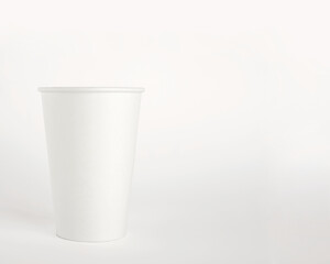 White paper disposable cup isolated on white background. Free space for your brand