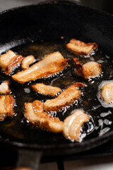 Lard in a pan. Cooking cracklings, Ukrainian cuisine.