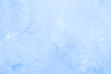 Obraz premium Natural frosty snowflakes during a snowfall. Lot of snowflakes on the surface of a snowdrift, macrophotography