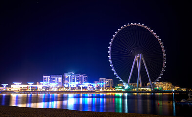 Ferris wheel against the blue sky in Dubai