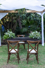 Elegant table in the garden with banquet and civil wedding service.