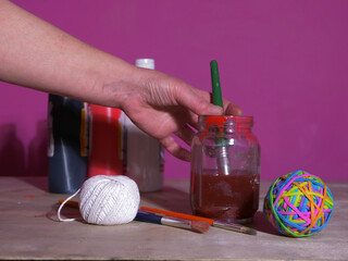 Artist with craft supplies for creative project 