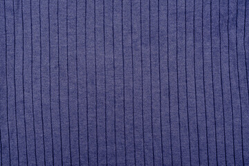 Blue fabric of factory production as background.