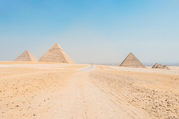 landscape of giza plateau with pyramids at background