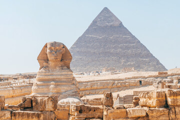 sphinx monument with pyramids at background, egypt