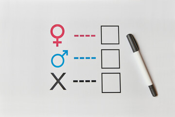 A person is determined by his gender. Sheet of paper with gender symbols. The right to one's identity.