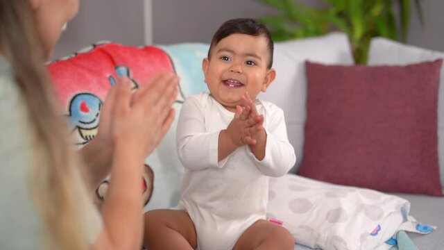 Baby clap and laugh. Fun, cute and happy images of baby clapping with his mother. This is a Slow motion video.
