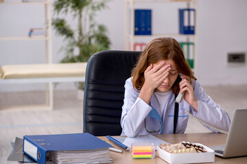 Young female doctor workiing in the clinic