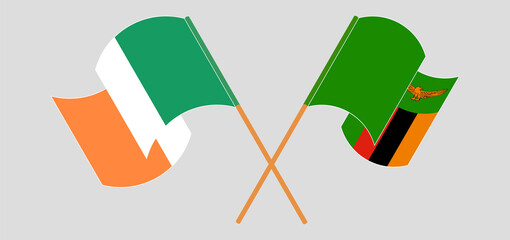 Crossed and waving flags of Ireland and Zambia