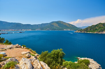 Fototapeta na wymiar Camellia island near Marmaris in Aegean Sea, blue lagoon and rocky mountains journey trip holiday