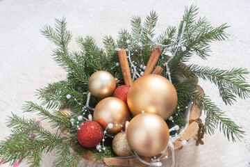 Gold and red balls, spruce twigs, Christmas garland Christmas decorations. Concept postcard for Christmas, New Year congratulations.