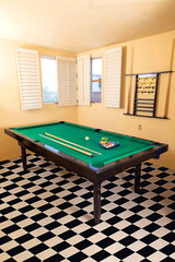 New pool table with balls and pool cues