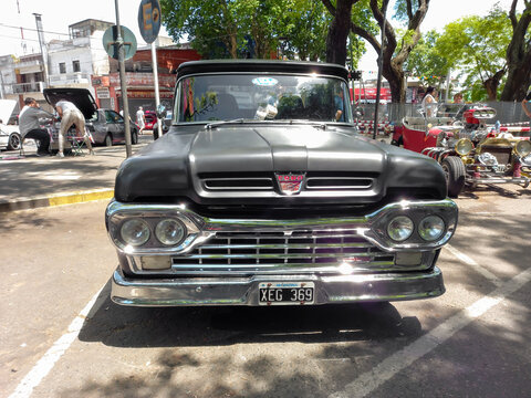 BUENOS AIRES, ARGENTINA - Nov 08, 2021: Ford F100 pickup truck 1960s Custom Cab Flareside bed. Front view. Expo Warnes 2021 classic cars
