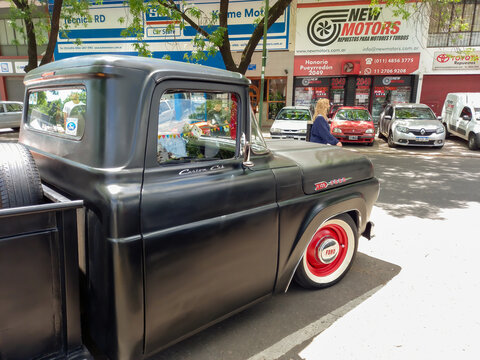 BUENOS AIRES, ARGENTINA - Nov 08, 2021: old Ford F100 pickup truck circa 1960 Custom Cab Flareside bed. Expo Warnes 2021 classic car show