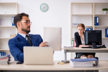 Two colleagues working in the office