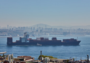 Fully loaded container ship moving through Bosprus