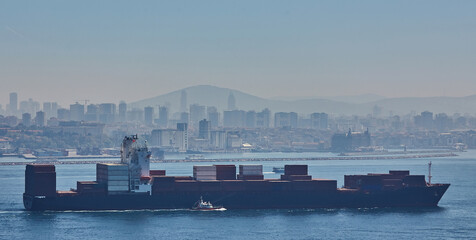 Fully loaded container ship moving through Bosprus