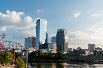 Panoramic skyline view of Broadway district of Nashville over Cumberland River at day time,...