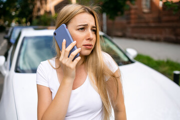 woman calls someone while towing, helping her on the road. Roadside assistance concept.