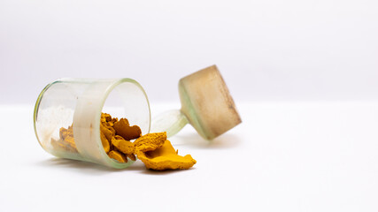 glass vessel with yellow powder