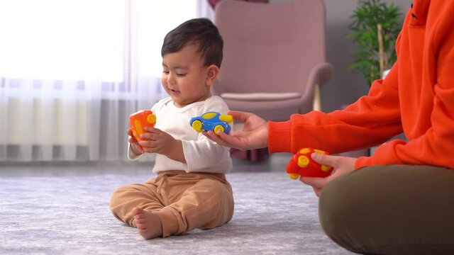 Happy baby. Baby bouncing on his but. Happy and funny. This is a Slow motion video.