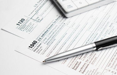 Income tax form and pen. Finance concept.