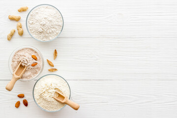 Various types of gluten free flour - almond peanut oat rice flour in bowls