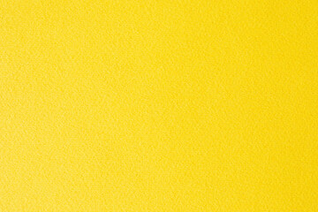 Yellow paper background or texture. Thick fibrous cardboard.