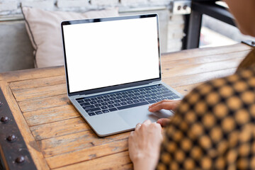 computer screen blank mockup.hand woman work using laptop with white background for advertising,contact business search information on desk at coffee shop.marketing and creative design