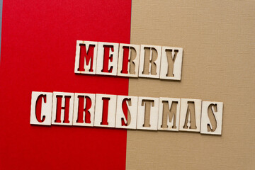 the expression "merry christmas" in wood stencil font