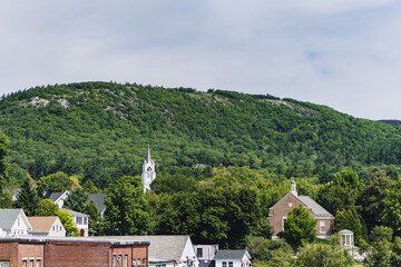 Small Town Charm - Wooded Mountain Towering Over Storybook Town