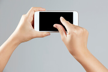Korean hand holding a smartphone