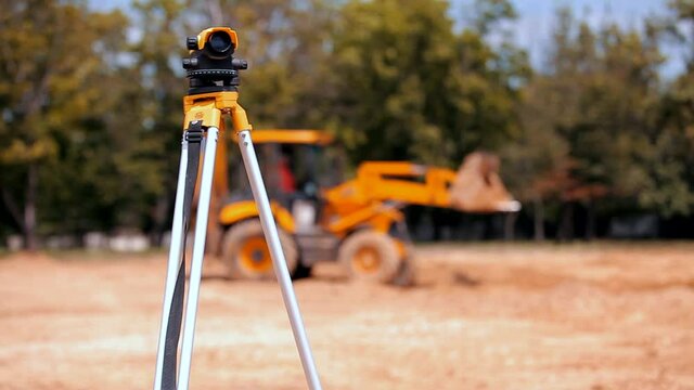 Geodesy at a construction site. Professional total station close-up. Construction equipment.