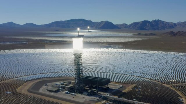 Aerial view of a molten salt, thermal, solar power plant - tracking, drone shot