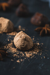 chocolate truffles over rustic wood table