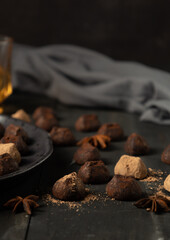 chocolate truffles over rustic wood table